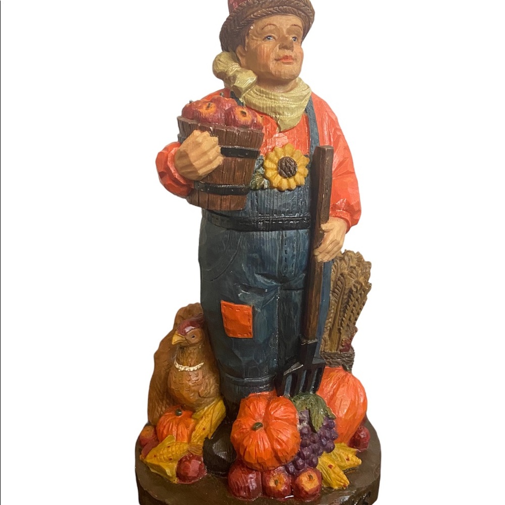 Fall harvest thanksgiving give thanks pumpkins statue 
Features pumpkin farmer
